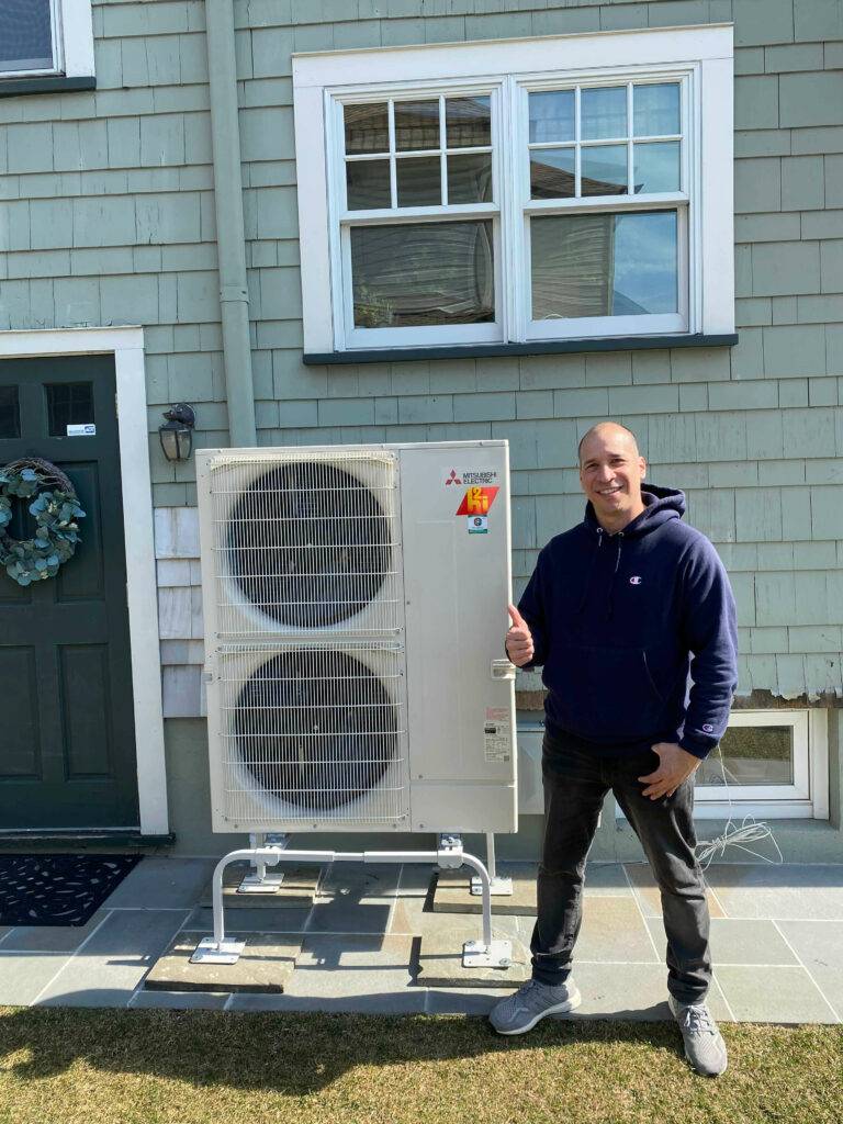 a happy homeowner with the HVAC expert service and benefits system